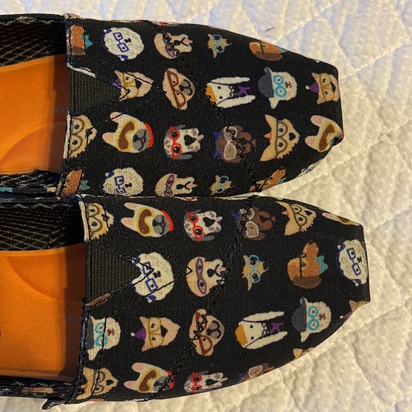 BOBS By Skechers slip on shoes in black with various dog designs on the shoes. - Picture 8 of 8
